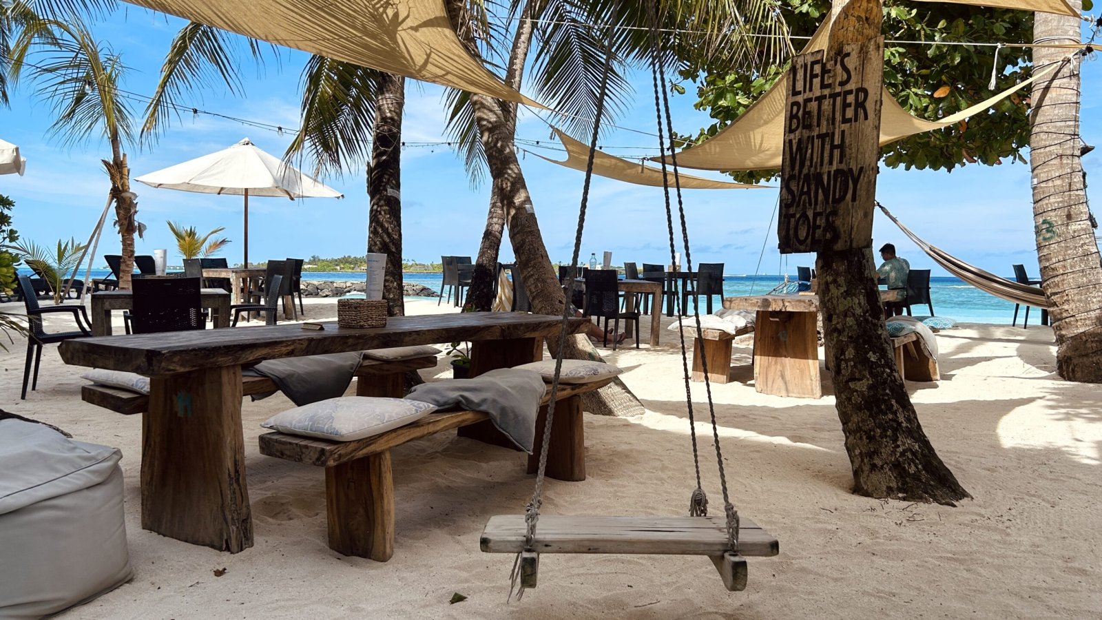 Beachfront restaurant and bar seating at Canopus Retreat