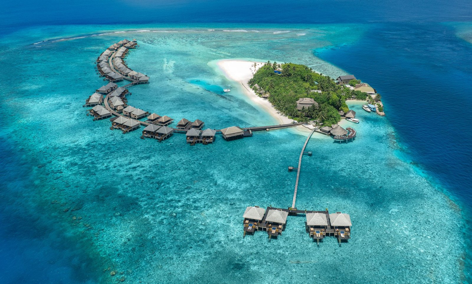 Aerial view of the island and its overwater villas