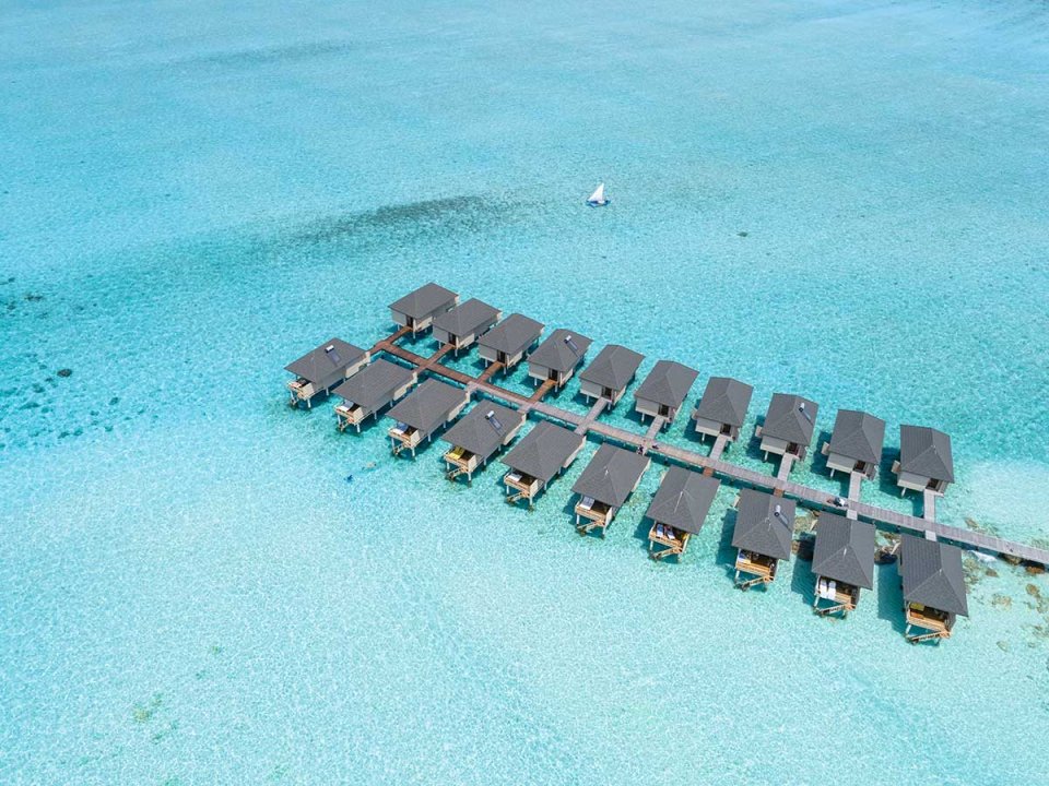 Aerial view of a row of overwater villas