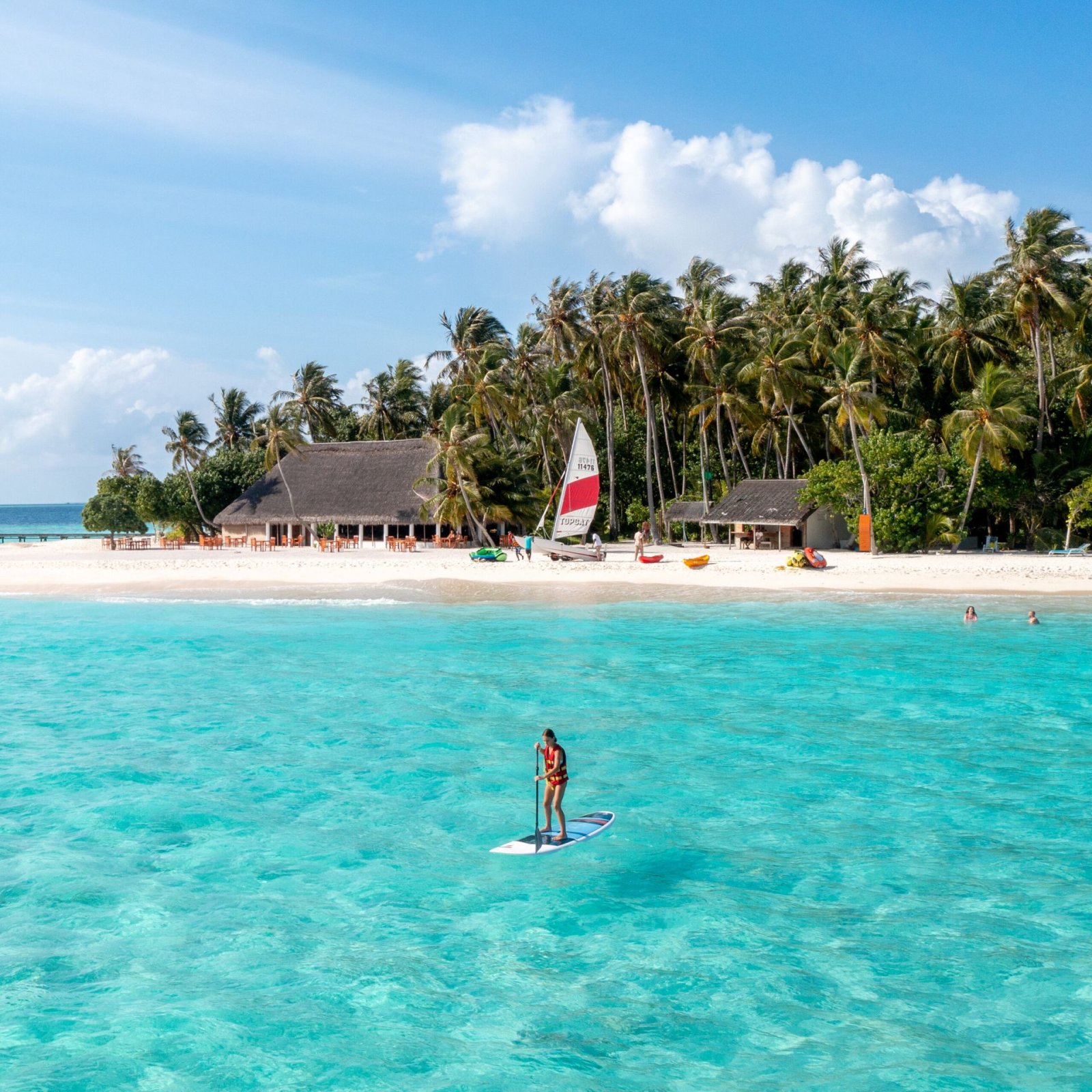 Stand-up paddleboarding off the beach