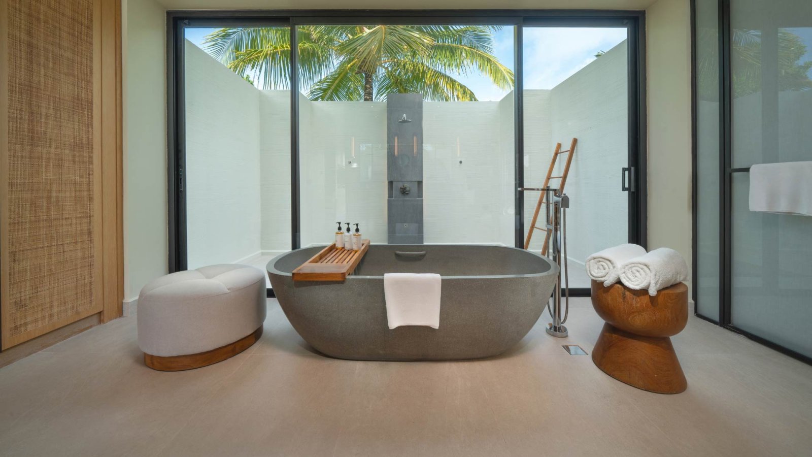 Villa bathroom with freestanding bath and outdoor shower