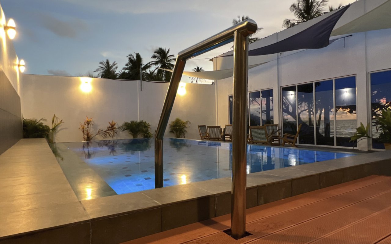Infinity swimming pool at Athiri Beach at dusk