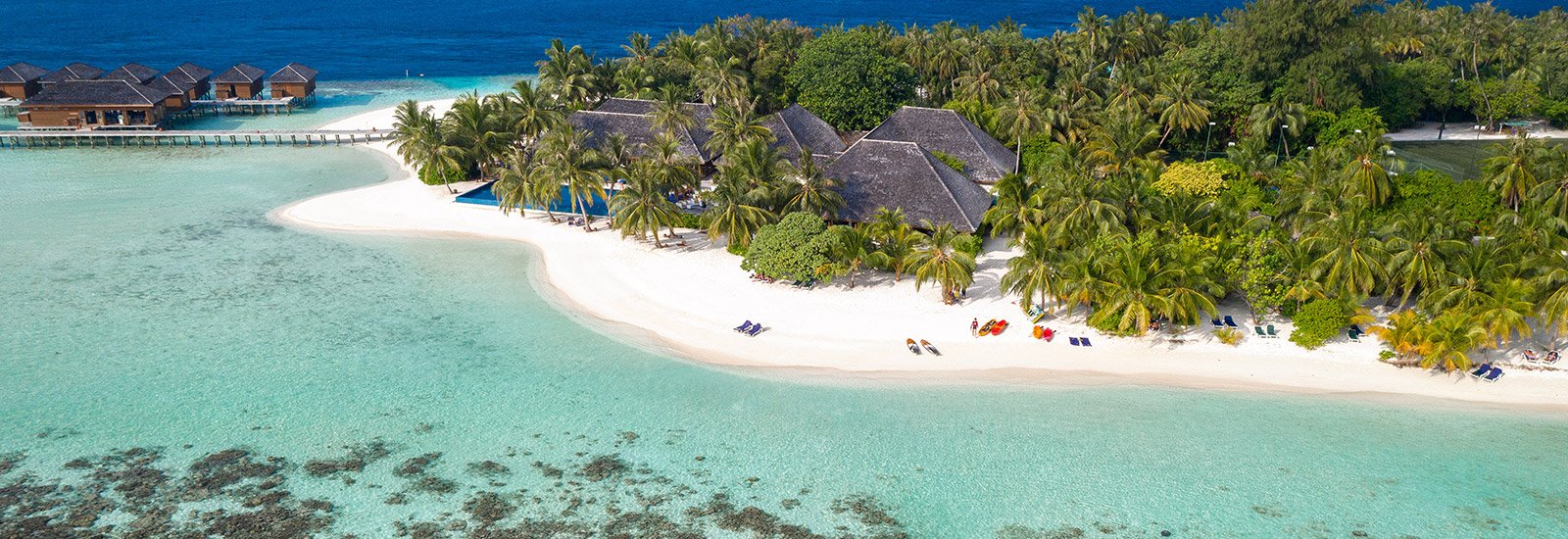 Vilamendhoo island with overwater villas seen from above