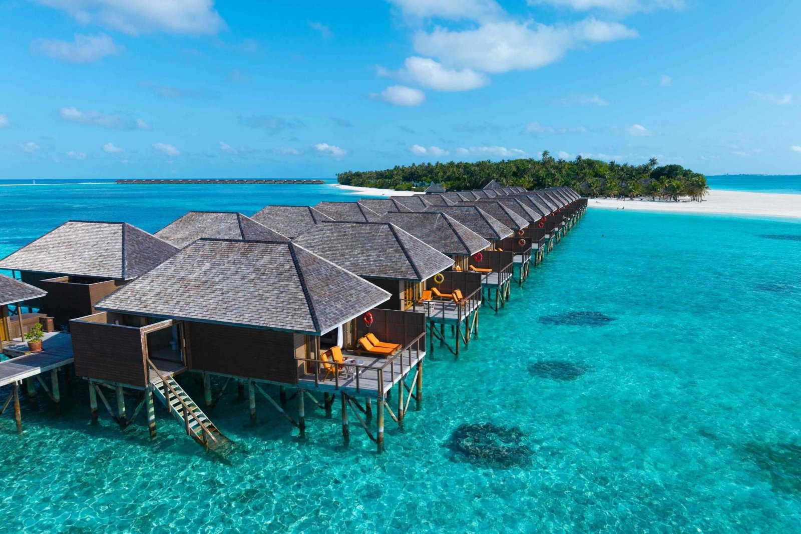 Aerial view of the overwater villas and the island