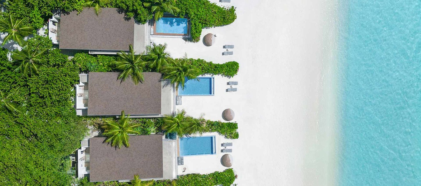Sunrise Beach Villa with Private Pool: Aerial of beach villa row