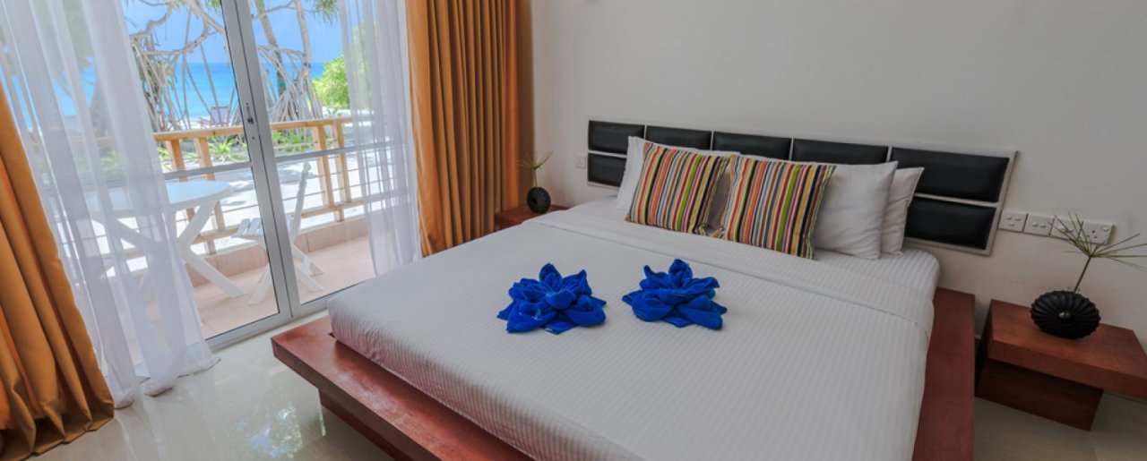 Ocean View Room at Athiri Beach Dhigurah - bed and balcony door