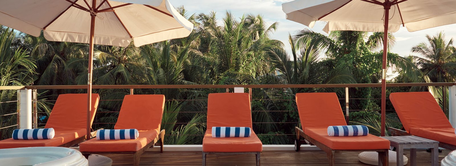 Sun loungers and umbrellas on the rooftop