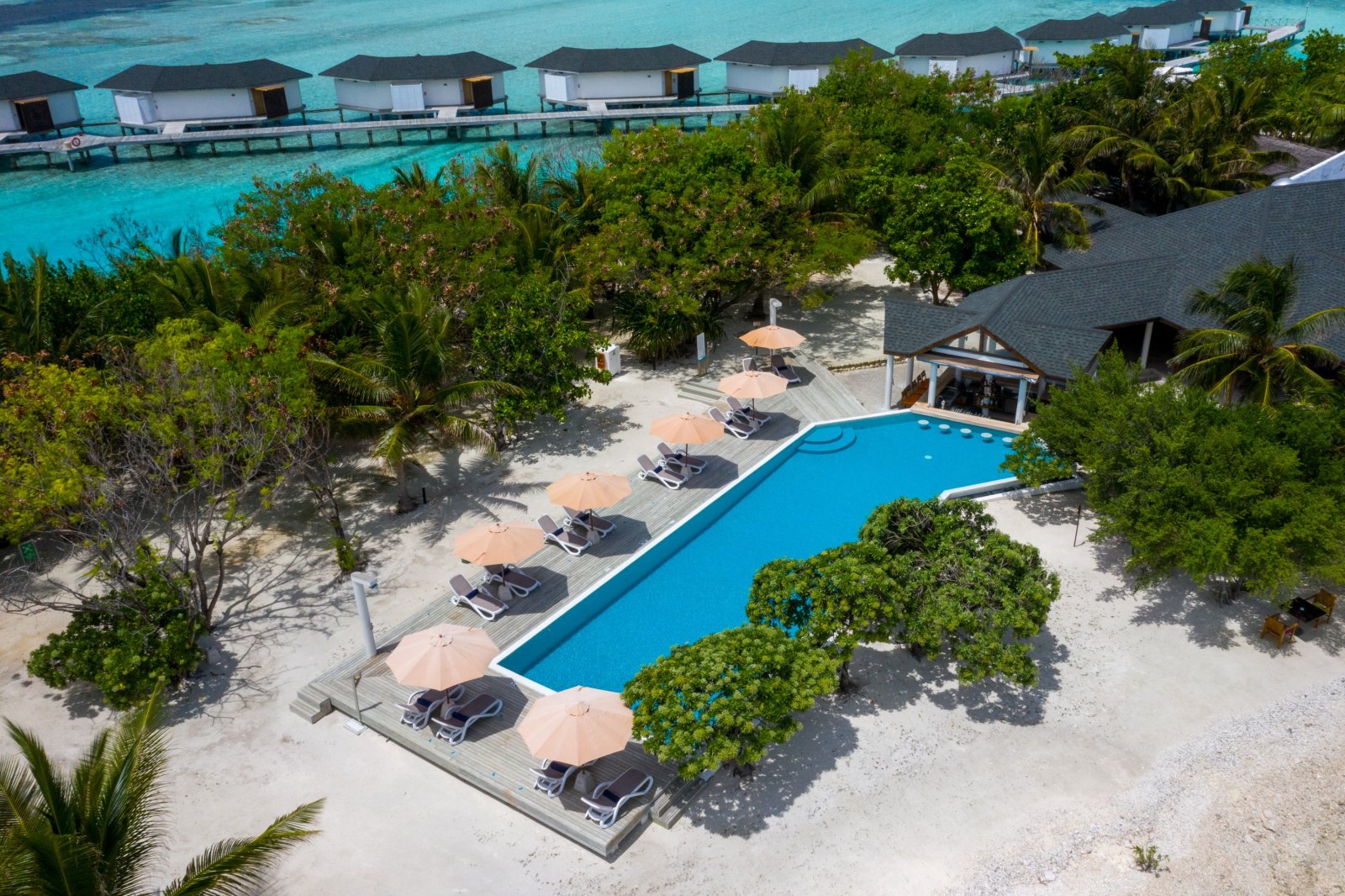 Aerial view of the pool and overwater bungalows
