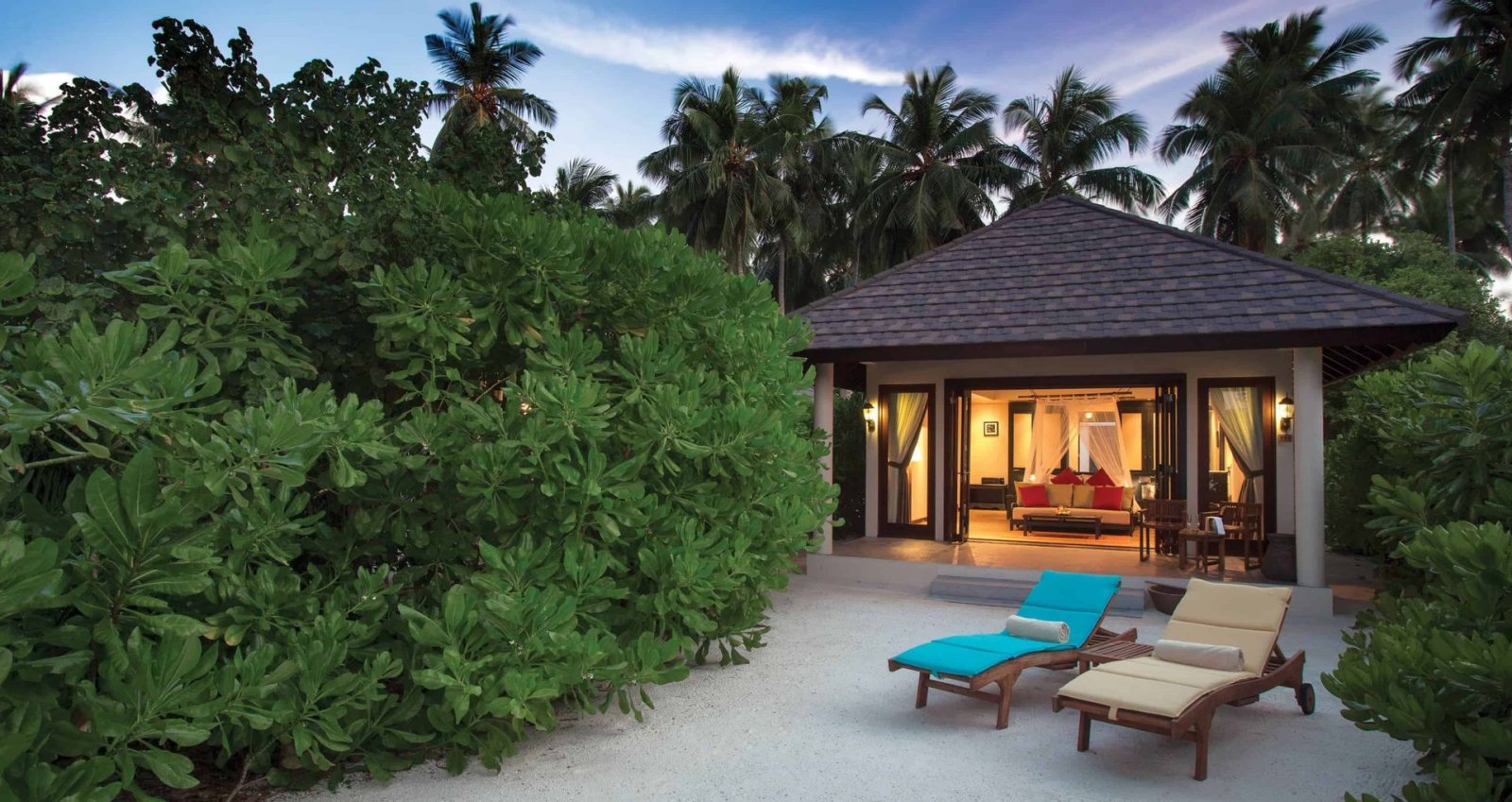 Villa exterior with sun loungers