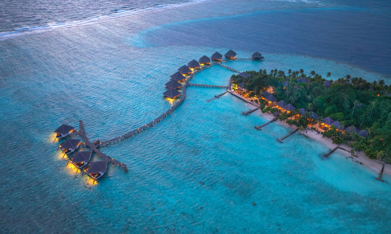 Aerial view of the island and jetty at dusk