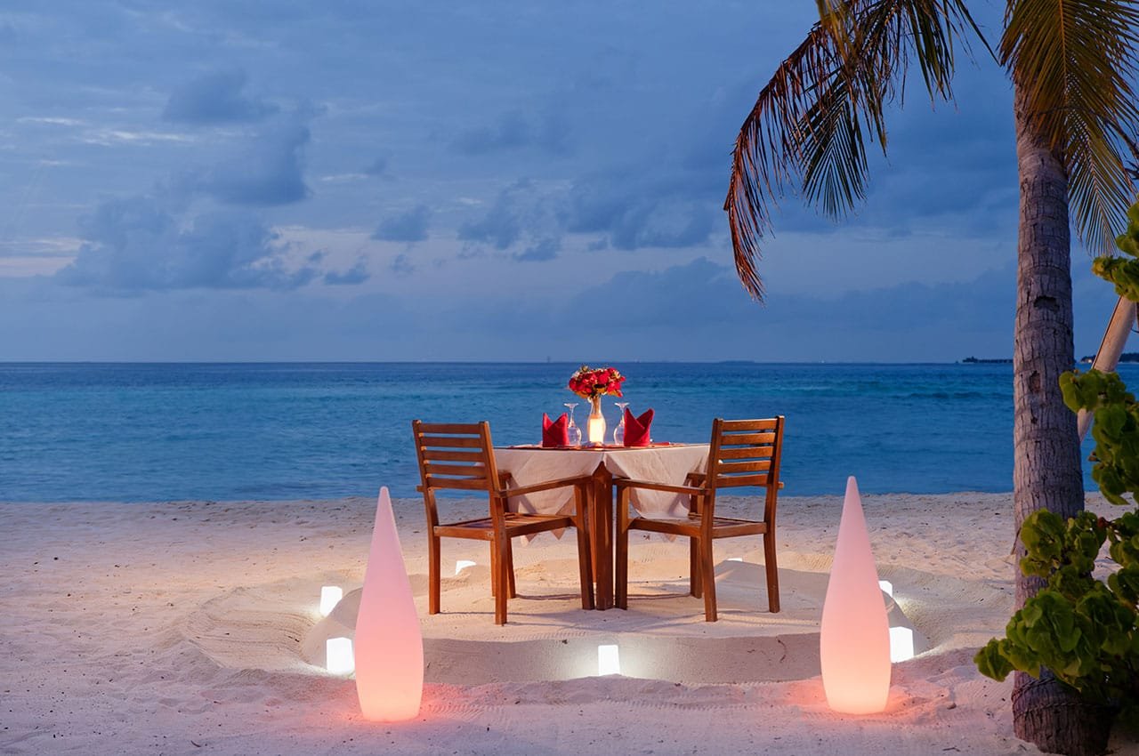 Candlelit dinner for two on the beach