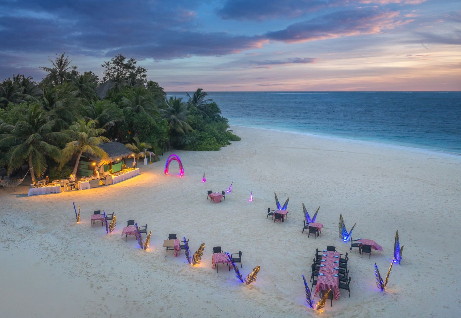 Beach dining set-up at dusk