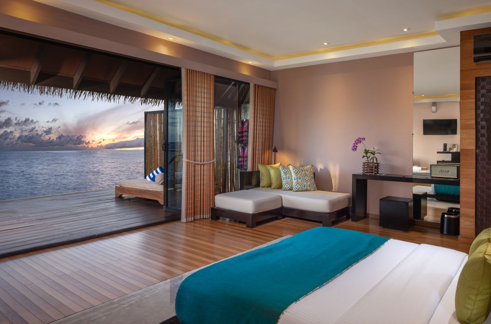 Overwater Villa with Jacuzzi: bedroom at sunset