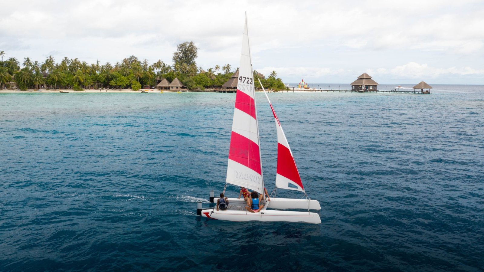 Catamaran sailing off the beach
