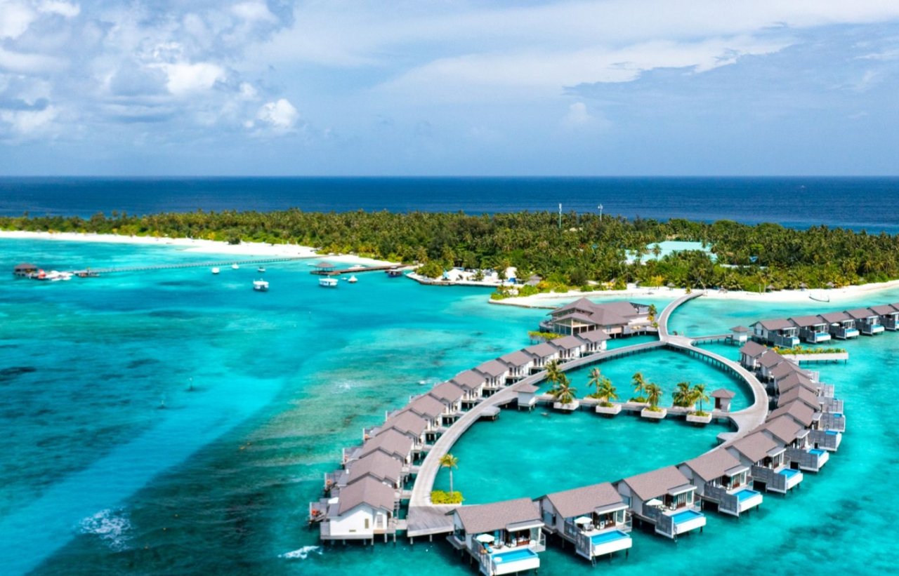 Overwater villas and island from above