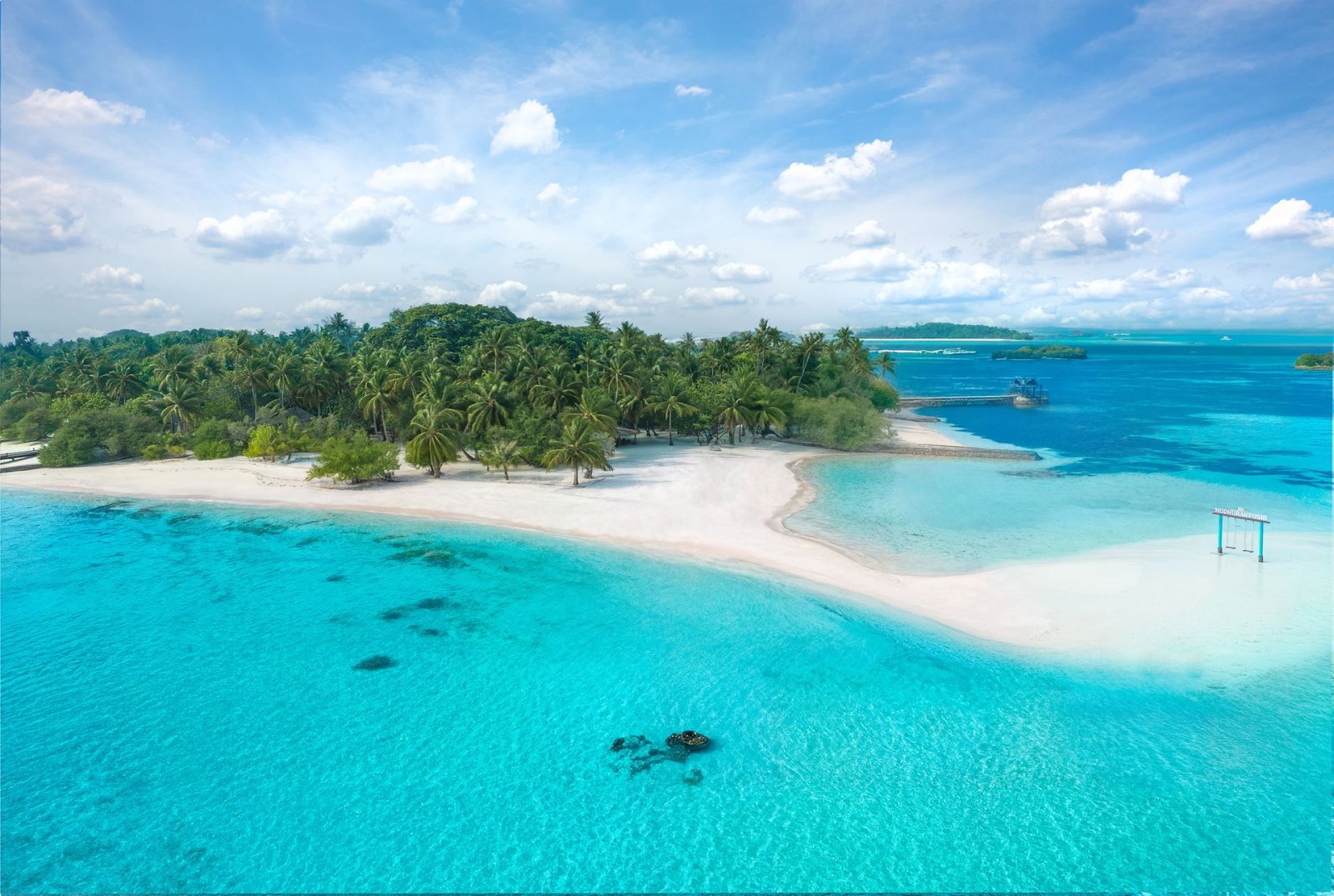 Aerial view of the island's white-sand beach and lagoon