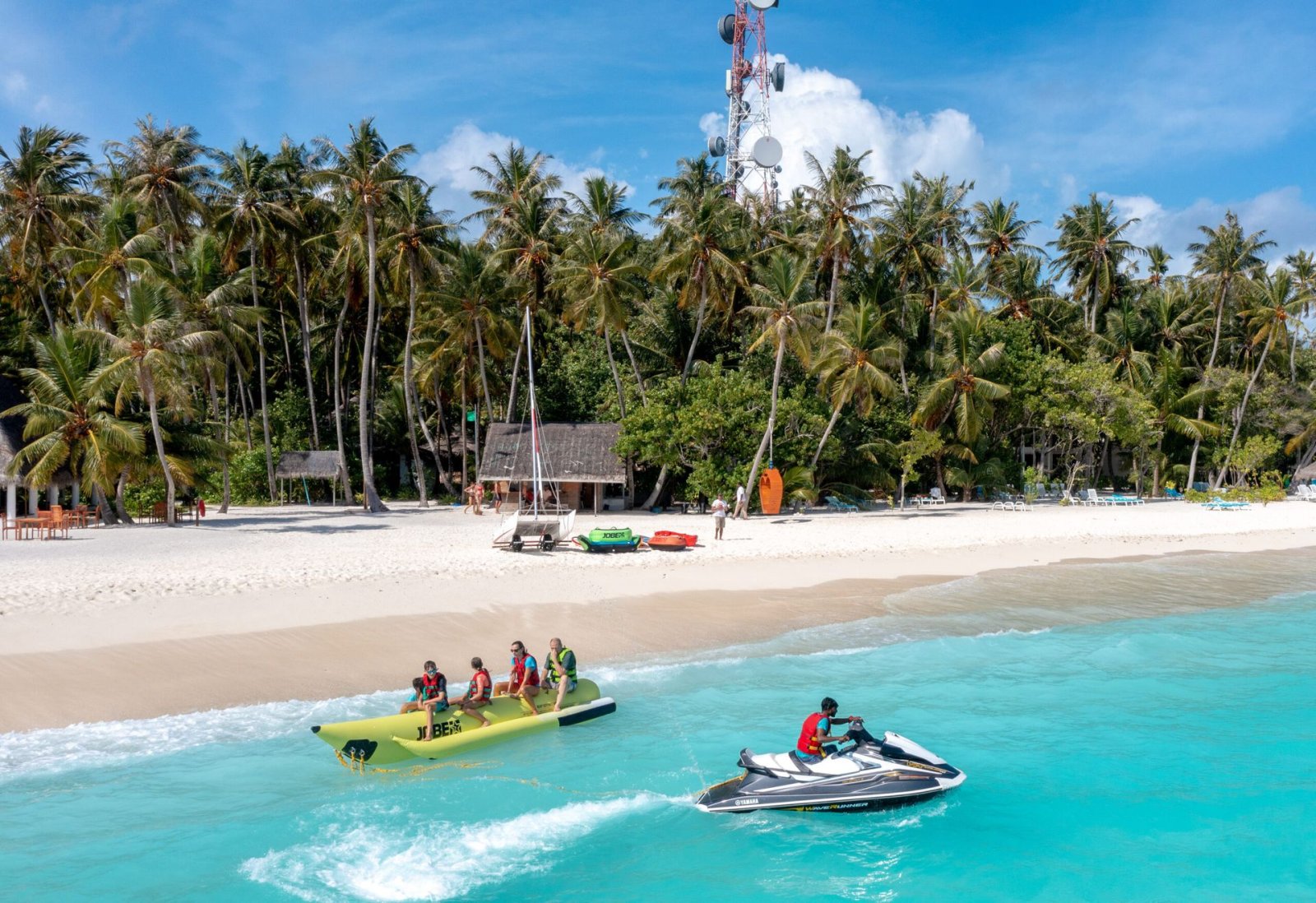 Banana boat and jet ski off the beach