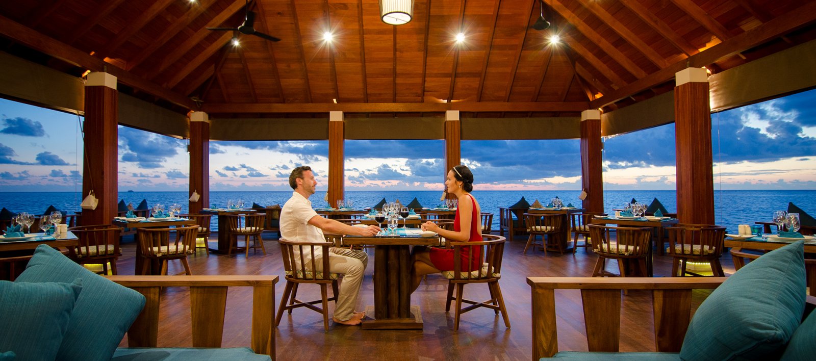 Couple dining at an ocean-view restaurant