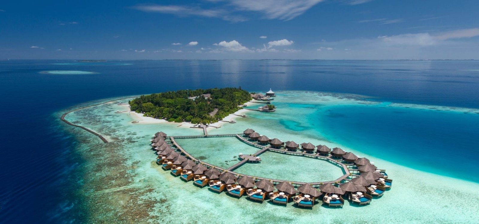 The island and overwater villas from above