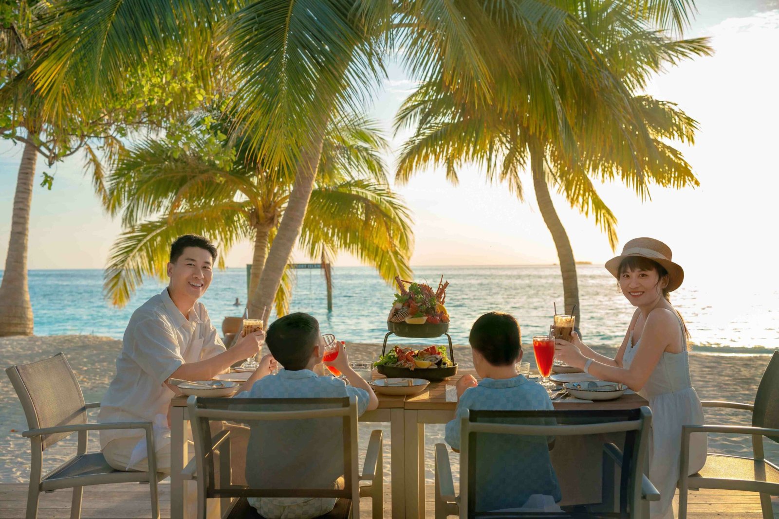 Family dining on the beach
