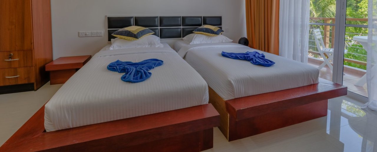 Family Room at Athiri Beach Dhigurah - twin beds