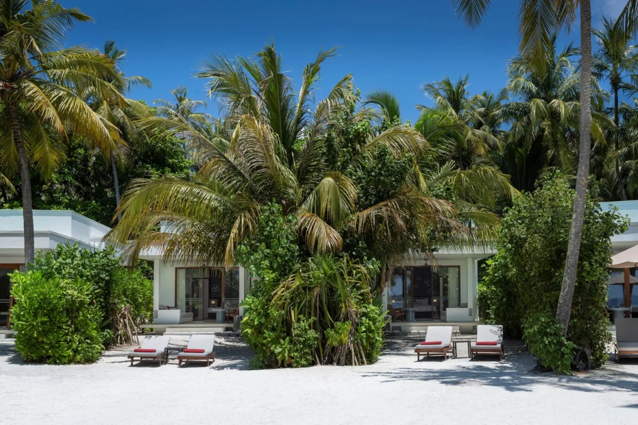 Bungalow front with sun loungers