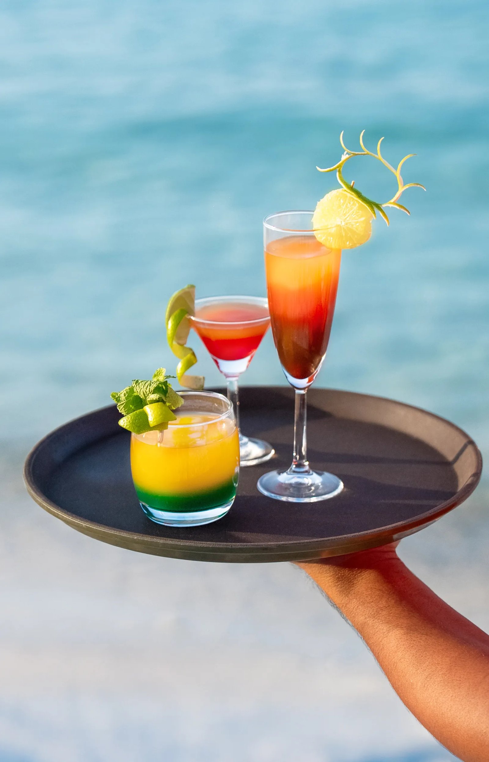 Tropical cocktails by the beach at Kaani Palm Beach