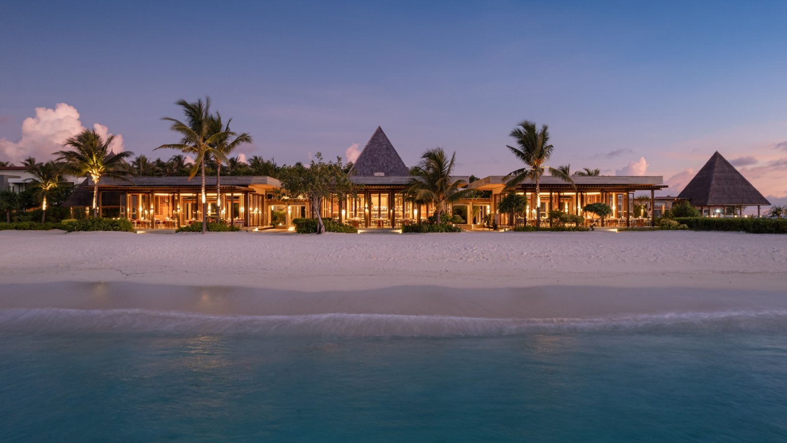 Beachfront dining pavilion at dusk