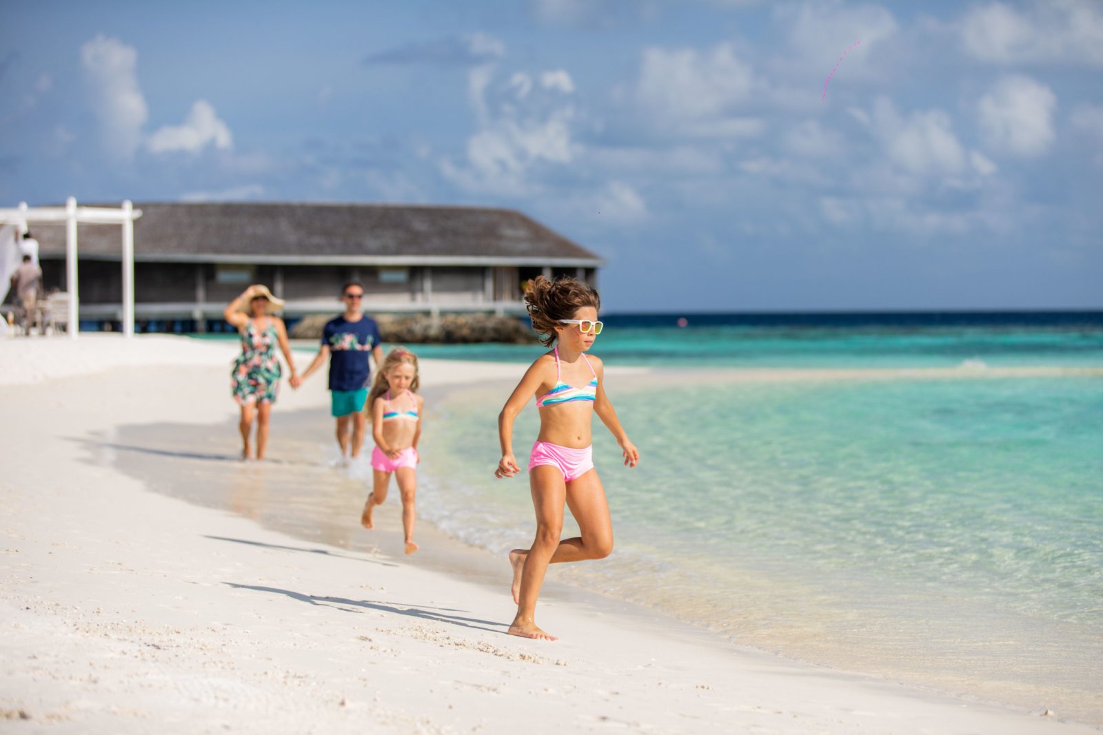 Family walking on the beach