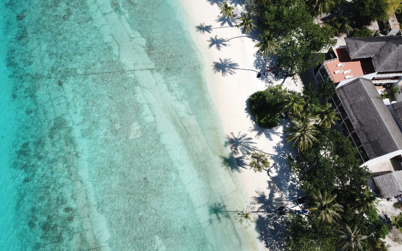 Dhigurah beach and building corner from above