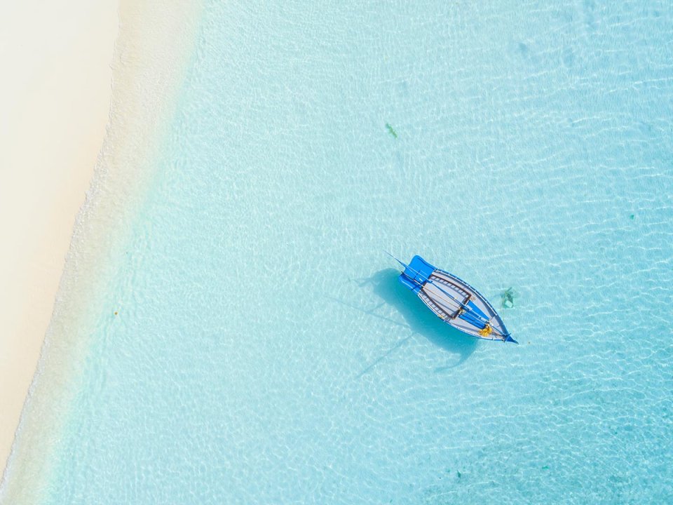 Aerial view of a traditional boat on the lagoon