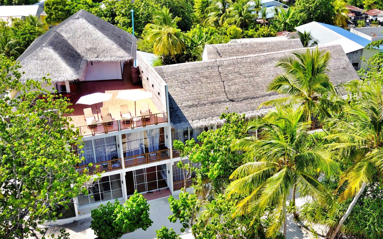 Aerial view of the buildings on Dhigurah (official home-page hero)